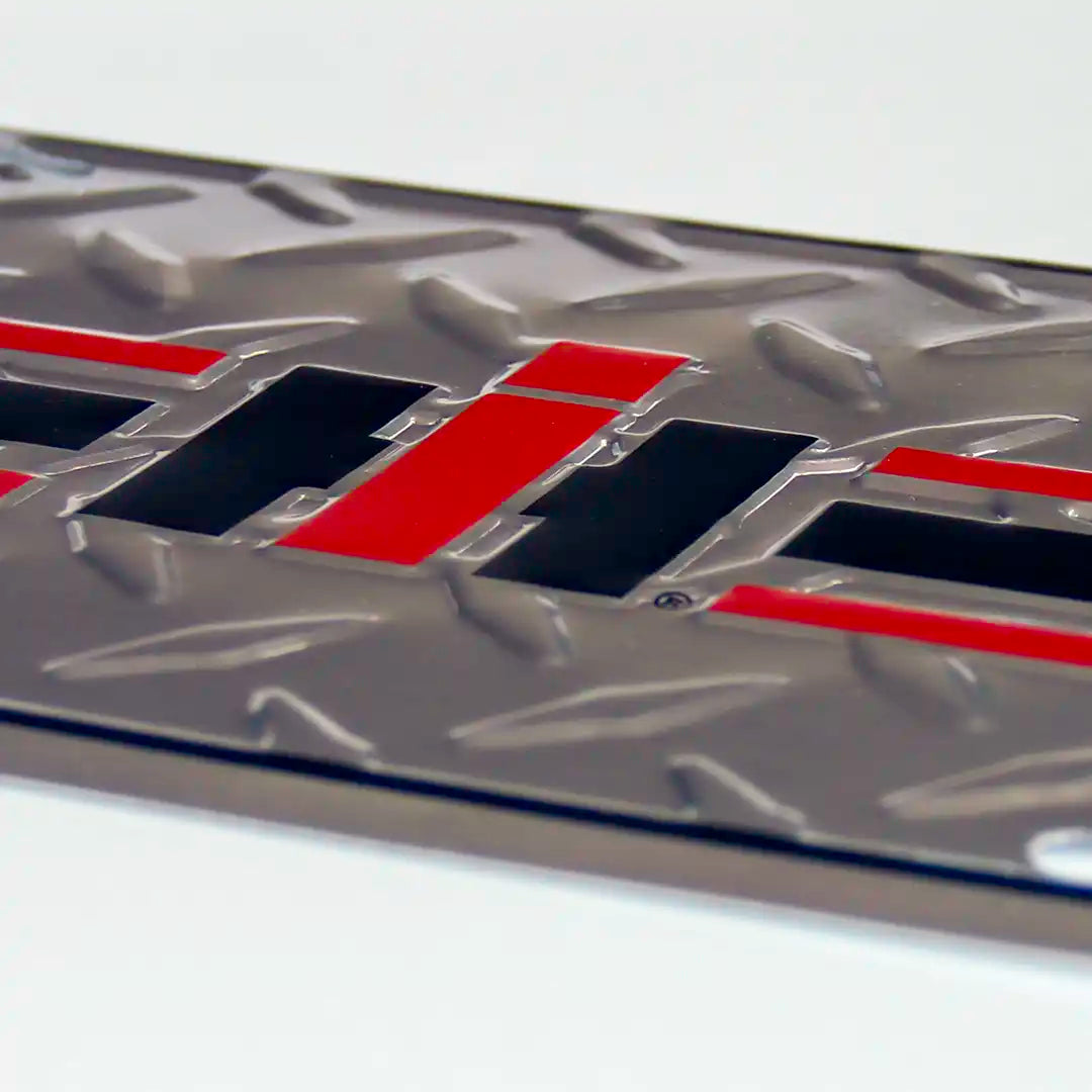 IH chrome embossed license plate close up view
