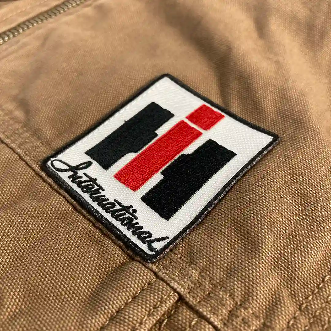 IH Vest Jacket front logo patch close up