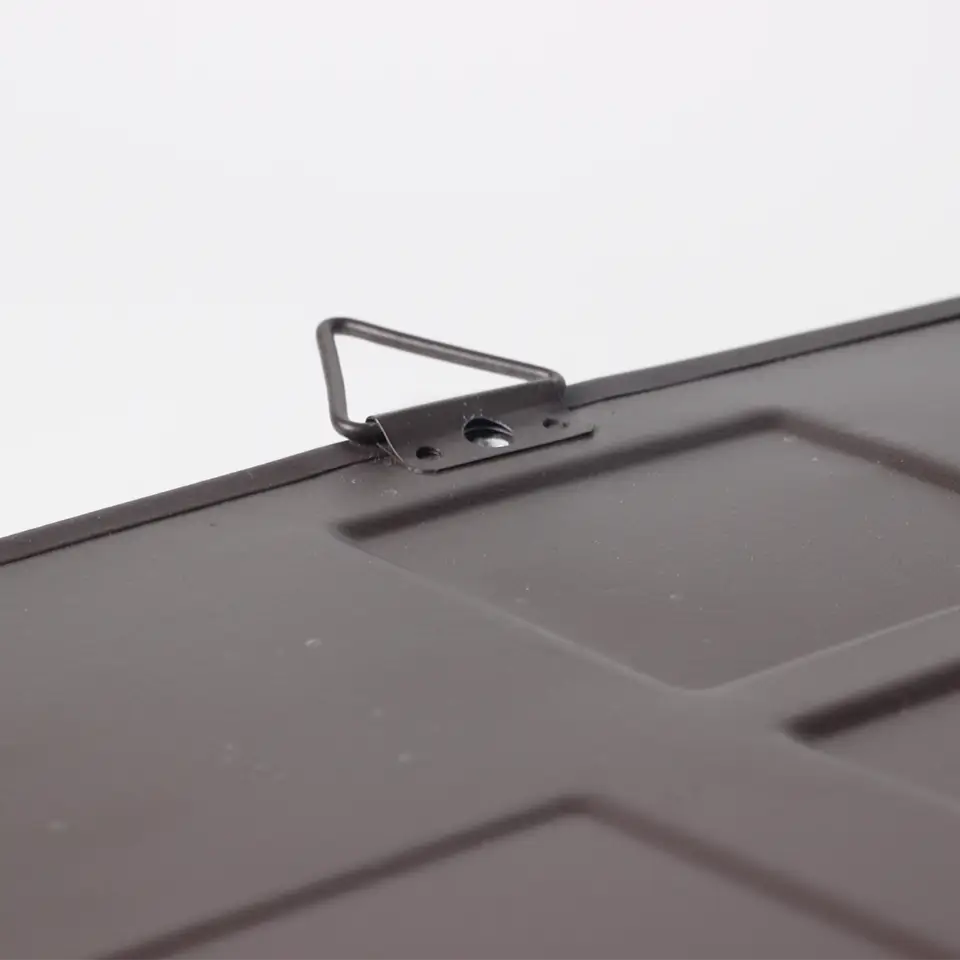 IH logo embossed tin sign backside with hanger