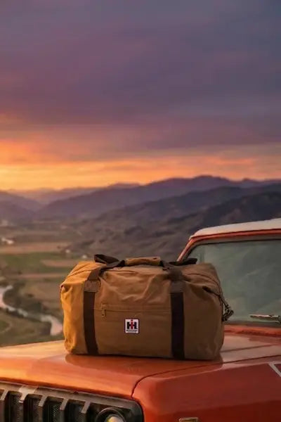 IH Weekend Warrior travel bag on hood of Scout II