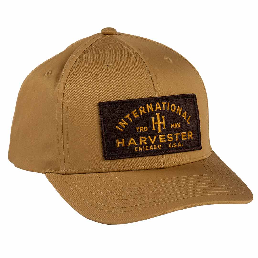 Brown cap with International Harvester vintage logo on a white background