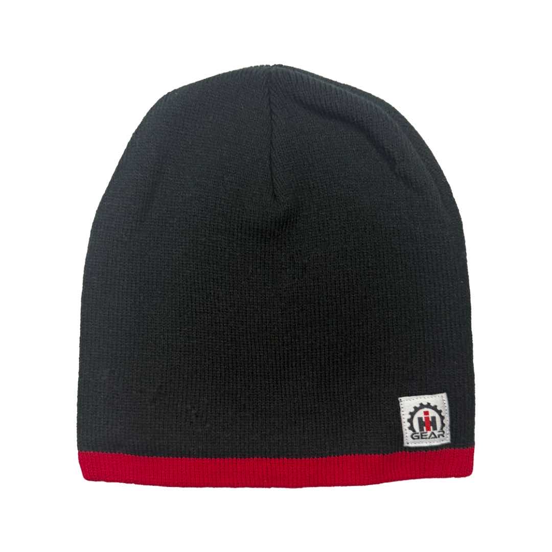 Black beanie with red rim and a international harvester logo on a white background