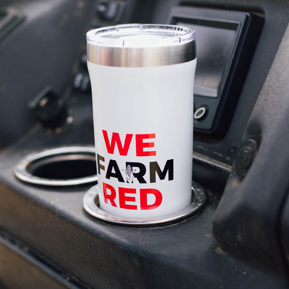 We farm IH red tumbler in side by side tractor